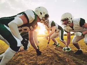 How do football players deal with their problems?