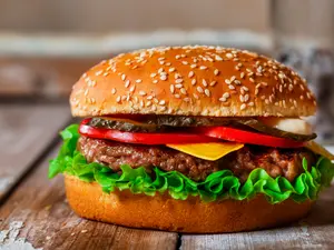 How do you make a hamburger laugh?