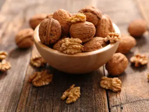 How do you make a walnut laugh?