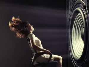 How does a witch play loud music?
