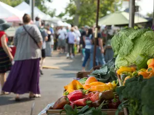 How much did the pirate pay for corn at the farmer's market?