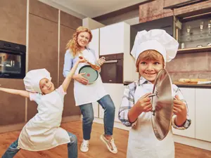What do families sing when it strikes midnight on Thanksgiving?