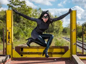 What does Catwoman always carry with her?