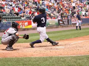 What runs around a baseball field but stays still at the same time?