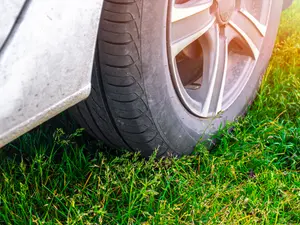 What should you do if someone parks their car on your lawn?