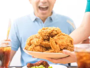 What's the name of the winner of the chicken-eating contest?