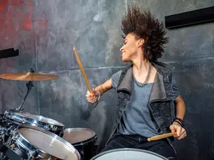 Why did the drummer keep banging her head against the drums?