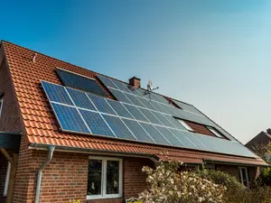 Why did the inventor install solar panels all over his house?