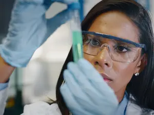 Why did the scientist hang the periodic table posters?