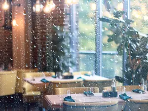 Why does rain make a great waiter at a restaurant?