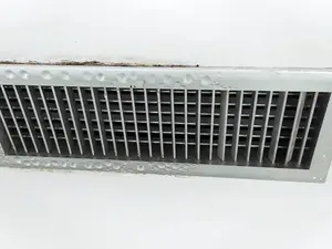 Why was the air compressor dripping with sweat?